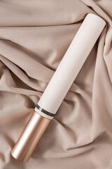 Naklejka premium Mascara tube on fabric