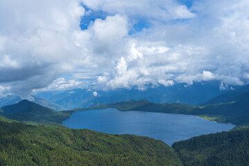  Beautiful freshwater lake view with cloudy blue-sky background—stunning view of the magical lake in the middle of the Himalayas.