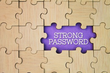 wooden puzzle with a hole in the middle with a strong password word. The concept of securing online accounts. account security
