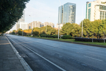 Fototapeta premium Empty urban road and buildings in the city
