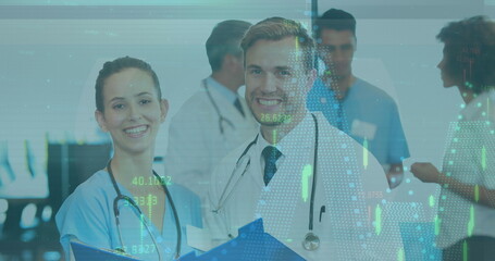 Image of financial data processing over diverse male and female doctor discussing at hospital