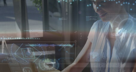 Image of round scanners and data processing over caucasian woman using laptop at cafe