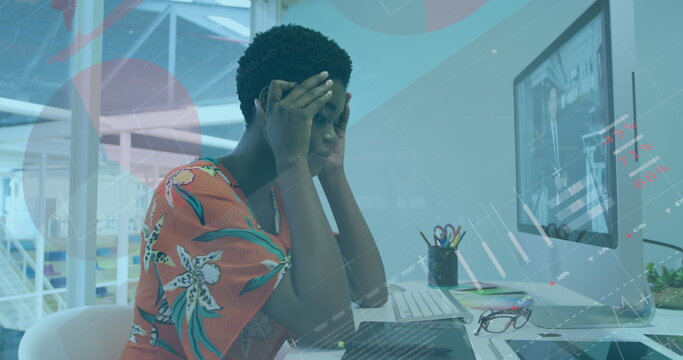 Image of infographic interface over tired african american woman working on desktop in office - Powered by Adobe