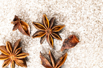 Spice star anise closeup on gray stone background