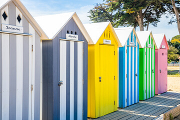 Front of multicolored bath cabins of the beach of La Bree-les-Bains, France