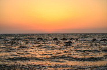 Fishing boat in the sea . Sea evening time background