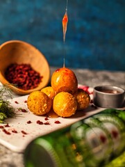 Fried Cheese Balls With Drizzled Sauce