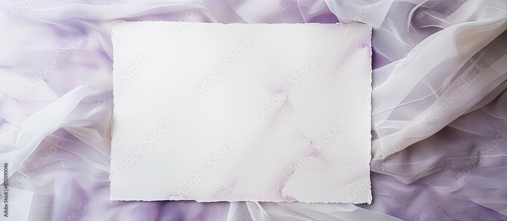 Aufkleber White paper sheet with watercolor frame on white fabric backdrop with violet background and copy space image.