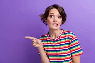 Photo of cute pretty girl wear stylish striped clothes demonstrate proposition blank space isolated...