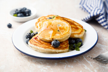 Homemade pancakes with blueberries and honey