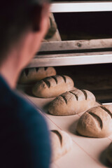 Baking bread in oven in a traditional bakery