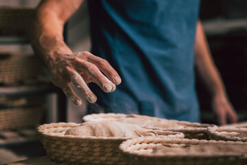 raw bread in basket in a traditional bakery
