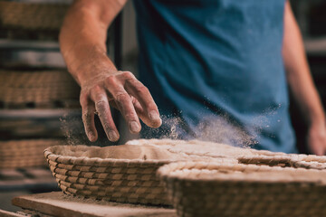 raw bread in basket in a traditional bakery