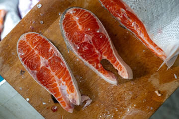 A tantalizing series showcasing the delicate art of preparing and presenting salmon sashimi