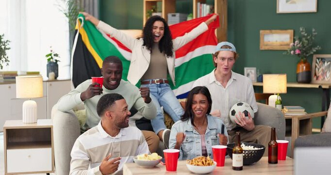 Group, friends and celebration on sofa watching tv for soccer, world cup or event in living room. South African flag, diversity and people with alcohol, happiness or goal from football team in home