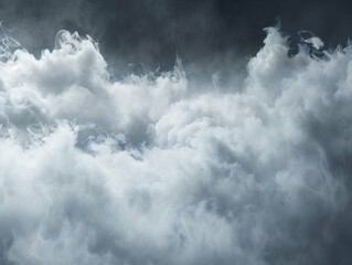 Obraz premium Dramatic, dense clouds with varying shades of grey and white, creating a powerful and moody sky scene.