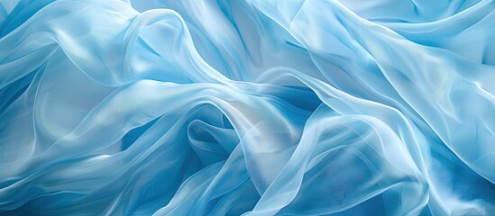 Obraz premium Blurry light blue chiffon or silk fabric for text on a copy space image.