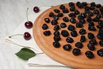 Dried cherries on a white background. Organic dried cherries. Side view. Space for text. 