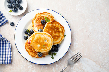 Homemade pancakes with blueberries and honey