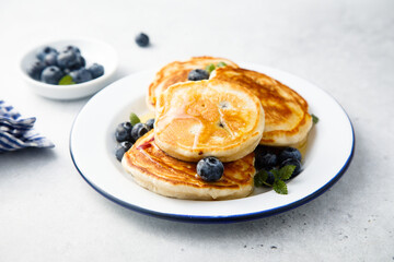 Homemade pancakes with blueberries and honey