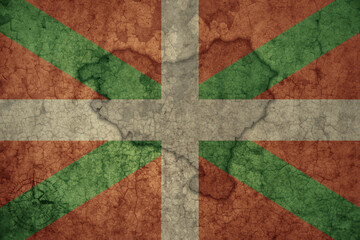 map and flag of basque country on a old vintage crack paper background .
