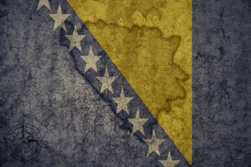 map and flag of bosnia and herzegovina on a old vintage crack paper background .