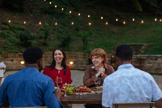 Laughter at an outdoor dinner party