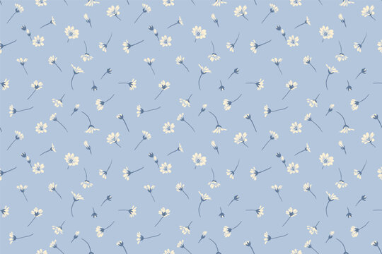 Pastel blue seamless pattern with tiny flowers and small buds. Abstract artistic floral minimalist print. Vector hand drawing sketch. Design for fashion, fabric, wallpaper, textiles,.