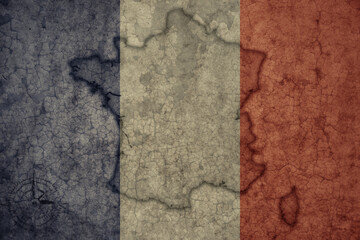 map and flag of france on a old vintage crack paper background .