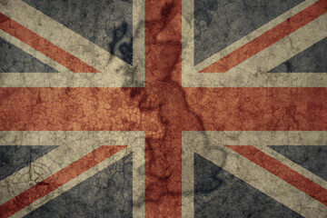 map and flag of great britain on a old vintage crack paper background .