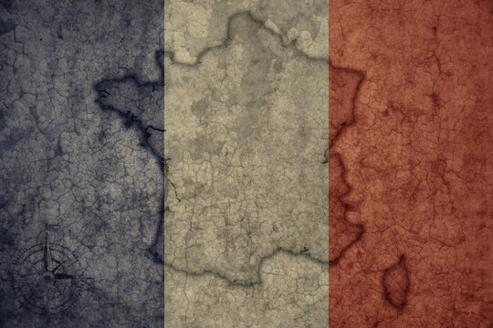 map and flag of france on a old vintage crack paper background .