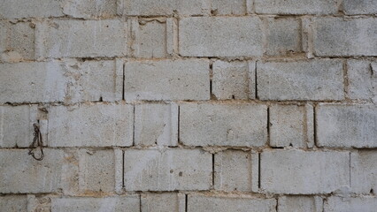 Wall made up of rectangular blocks. reticular construction. Image for backgrounds.