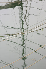 Port of Douarnenez, reflections of boats. France.