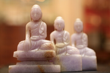 Buddha statuettes in pink marble. Meditation. France.