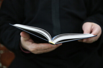 Man reading the Quran in a mosque.  France.