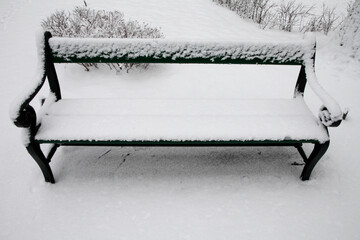 Public bench under snow. Winter.  Saint Petersburg. Russia.