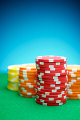 Casino chips on a green mat