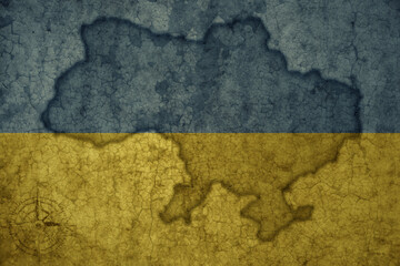 map and flag of ukraine on a old vintage crack paper background .