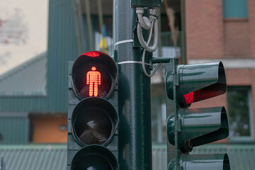 traffic light, road sign with a red shape and light, indicates that you cannot cross the road at an...