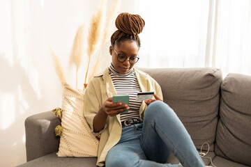 African American woman Online banking from home 