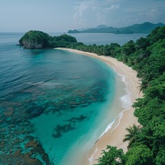 Obraz premium A beautiful beach with a rocky island in the background