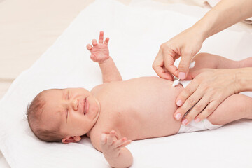 Mother Cleaning Newborn Babys Navel