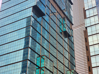 Modern blue-glass window architecture of office buildings in Jakarta. Business and finance concept.