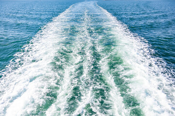 Water blue ocean splash and boat in the sea way background