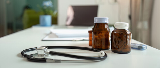 Modern Healthcare Medicine Physician Office with Stethoscope and Prescription Bottles on Desk