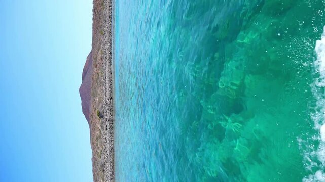 Clear ocean water by Isla Coronado, Baja California Sur. Vertical video