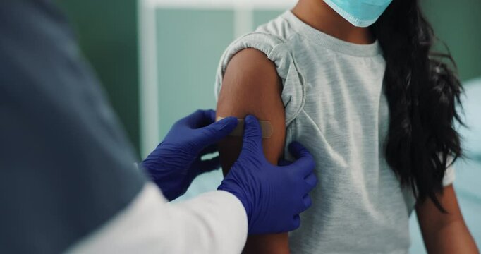 Clinic, nurse and arm of woman with plaster in injection for healthcare, protection and virus safety. Medical, ppe and people with bandage in consultation for covid vaccine, immunization and benefit