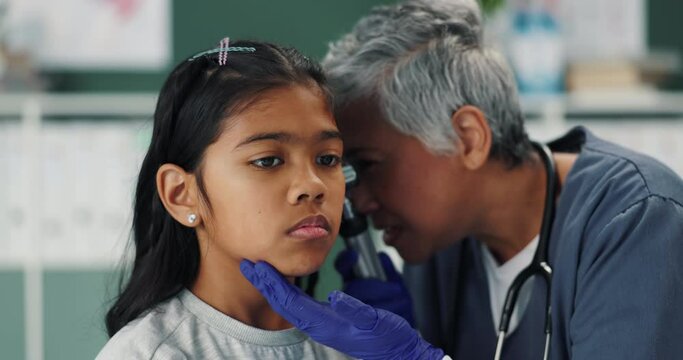 Nurse, child and check ear with otoscope for healthcare, wellness and service in hospital. Ent, girl and kid with medical pediatrician for test, hearing exam or diagnosis of patient with audiologist