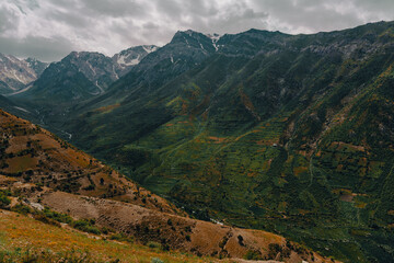 Fototapeta premium The mountains are covered in snow and the sky is cloudy