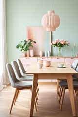 A modern dining room featuring a sturdy wooden table surrounded by matching chairs. The room is decorated with minimalist clean lines, creating a Scandinavian-inspired aesthetic